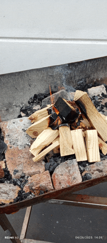 a redmi a3 shows a fire burning on a table