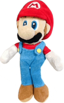 a stuffed mario doll with overalls and a red hat