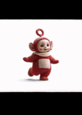 a red teletubbies doll is standing in front of a white background with korean writing on it