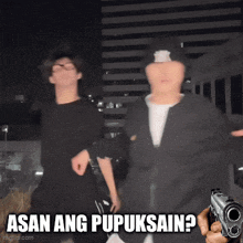a man holding a gun with the words asan ang pupuksain behind him