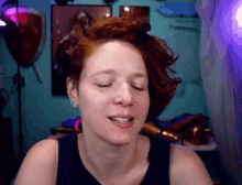 a woman with red hair is making a funny face
