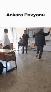 a group of people in a classroom with the words ankara pavyonu on the top