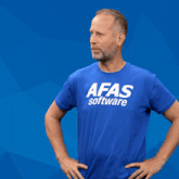 a man wearing a blue shirt with the word software on it