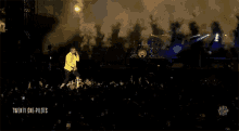 twenty one pilots performing on a stage with smoke coming out of it