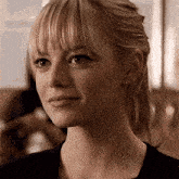 a close up of a woman 's face with blonde hair