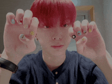 a young man with red hair has a watch on his wrist