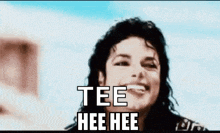 a close up of a man 's face with the words `` tee hee hee '' written on it .