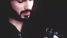 a close up of a man 's face with the words niyas.nha on the bottom