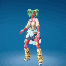 a girl with a green face and horns is dancing