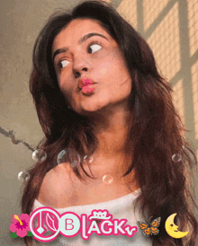 a woman making a funny face with bubbles and the word black