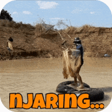 a man is standing on a raft in the middle of a river with the word njaring written above him