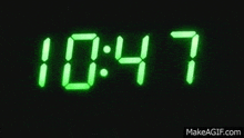 a digital clock that says 10:58 on it