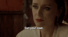 a woman with red lipstick says get your coat you 've pulled .