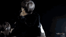 a couple of people hugging with the words let the music play in the corner