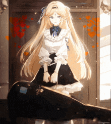 a girl with long blonde hair is holding a guitar case in front of a door
