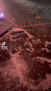 a tik tok video of a puddle of water