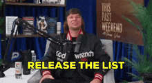 a man sitting in front of a microphone with the words release the list