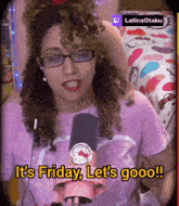 a woman wearing glasses and a hello kitty shirt says it 's friday let 's goooo