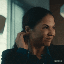 a close up of a woman 's face with the word netflix on the bottom