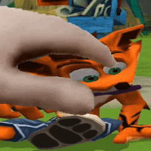 a hand is reaching out to touch a cartoon character 's face
