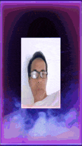a pixelated image of a man wearing glasses and a white shirt