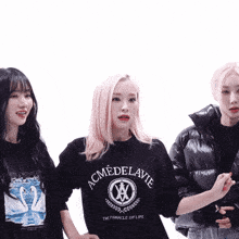 a woman wearing a black shirt that says acme de lavie