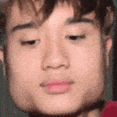 a close up of a man 's face with his eyes closed and his mouth open .