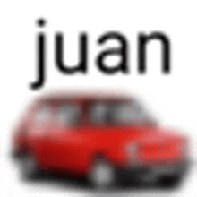 a blurry picture of a red car with the name juan on it