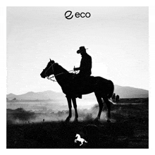 a black and white photo of a man riding a horse with the word eco on the bottom right