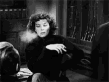 Blow Smoke Katharine Hepburn GIF - Blow Smoke Katharine Hepburn Cigarette GIFs
