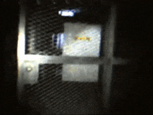a dark room with a sign that says ' emergency exit '
