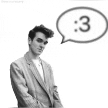 a black and white photo of a man with a speech bubble with the number 3 in it