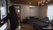 a woman is standing in a living room with the words flexi room written on the wall
