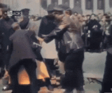 a group of people are dancing in front of a sign that says 24 aok