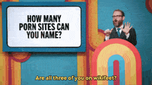 a man stands in front of a sign that asks how many porn sites can you name