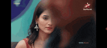 a close up of a woman 's face with a star plus hd logo