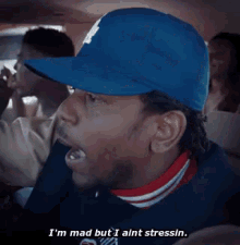a pixelated image of a man in a hat saying i 'm mad but i ain 't stressin
