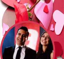 a man and a woman are standing next to each other in front of hearts