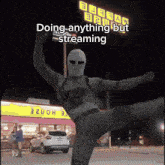 a man in a mask is doing anything but streaming in front of a burrito bowl restaurant