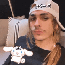 a man wearing a hat that says pato 3
