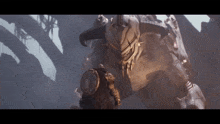 a man with a shield standing in front of a monster