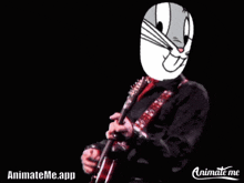 a man playing a guitar with bugs bunny 's face on his face