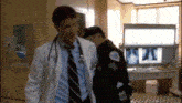 a doctor and a police officer are walking in a hospital room