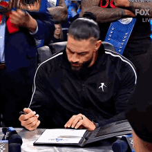 Roman Reigns Signing Contract GIF
