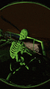 a skeleton is driving a car in a green light
