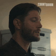 a close up of a man 's face with the word countdown on the bottom right