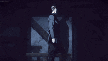 a blurry picture of a person standing in front of a fire in a dark room .