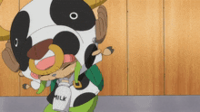 a cartoon character wearing a cow costume carrying a bottle of milk