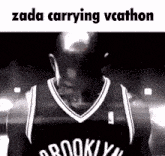 a black and white photo of a brooklyn nets basketball player with the caption zada carrying vecathon