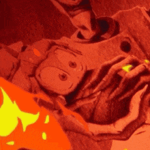 a close up of a person 's hands holding a cartoon character in a red background .